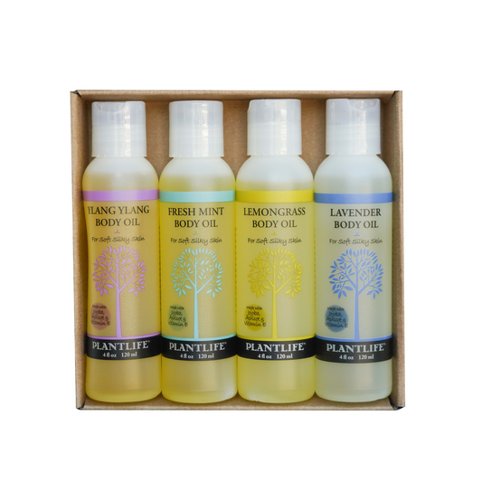 Plantlife Body Oil Gift Set featuring four 4oz bottles in Ylang Ylang, Fresh Mint, Lemongrass, and Lavender scents, made with jojoba, apricot, and vitamin E.
