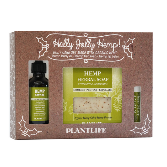 Plantlife Holly Jolly Hemp holiday gift set featuring hemp body oil, hemp herbal soap, and hemp mint lip balm in festive packaging.