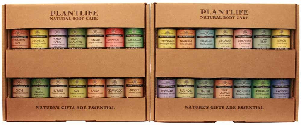 Plantlife Natural Body Care essential oil display with 28 assorted 10ml bottles, organized in kraft cardboard trays featuring a variety of aromatherapy scents.