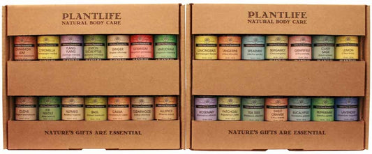 Plantlife Natural Body Care essential oil display with 28 assorted 10ml bottles, organized in kraft cardboard trays featuring a variety of aromatherapy scents.