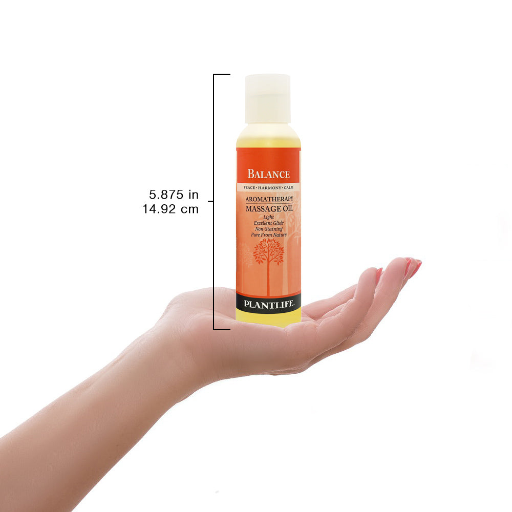 Plantlife Balance massage oil bottle shown with scale for size reference.