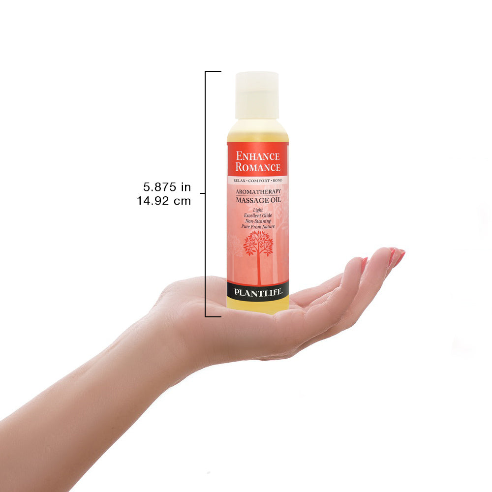 Plantlife Enhance Romance massage oil bottle shown with scale for size reference and sensual blend details