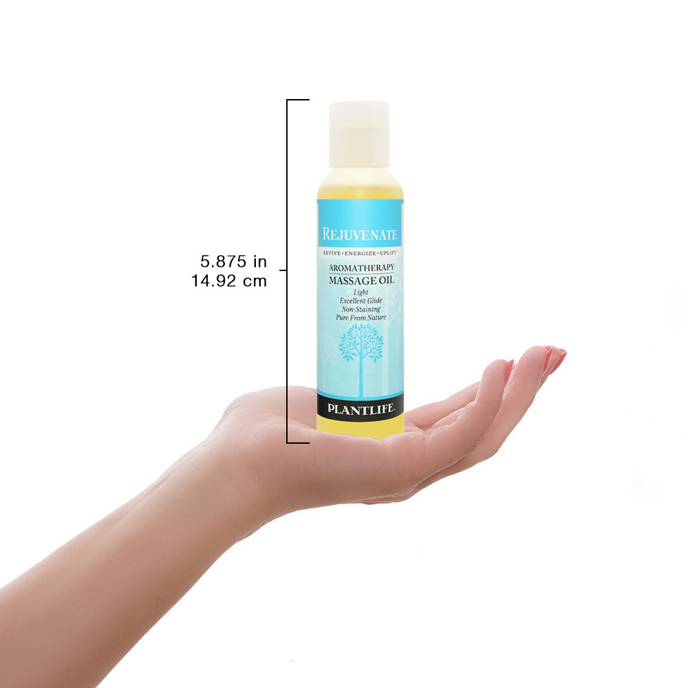 Plantlife Rejuvenate massage oil bottle shown with scale for size reference and product details.