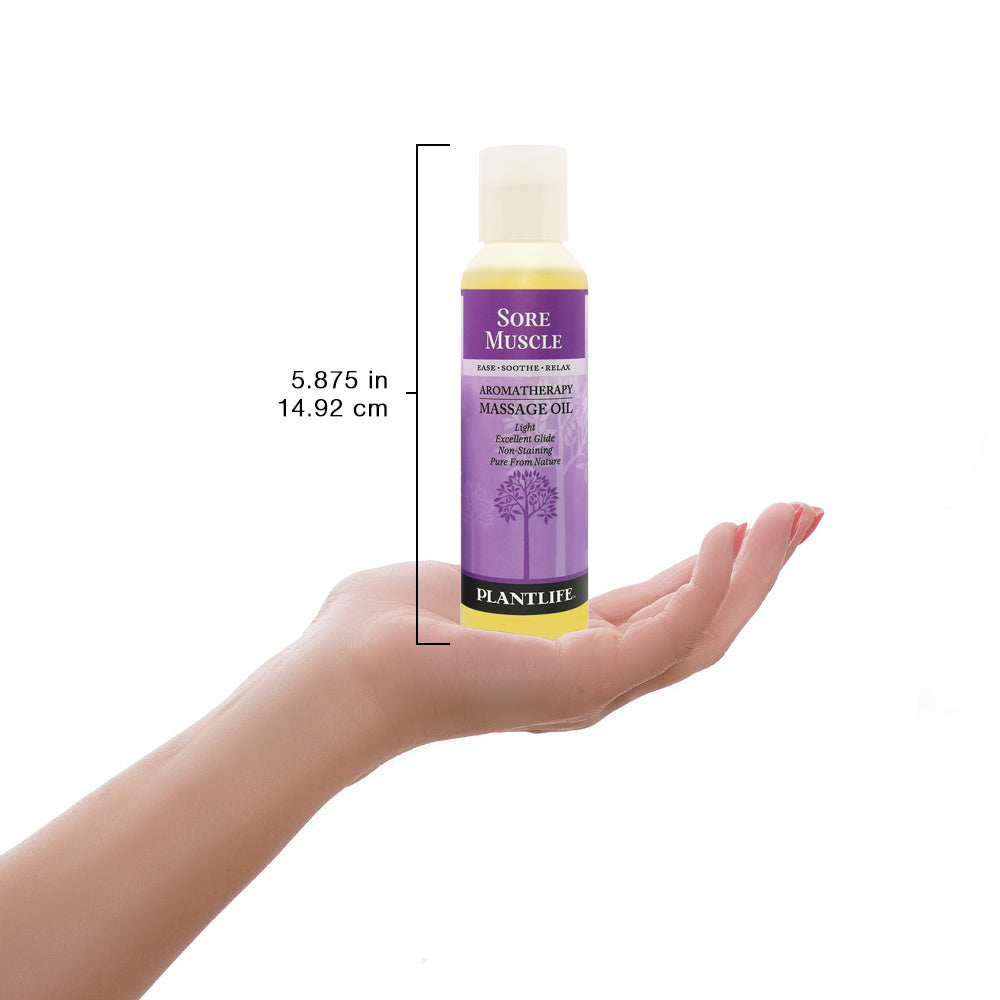 Plantlife Sore Muscle massage oil bottle shown with scale for size reference and product details