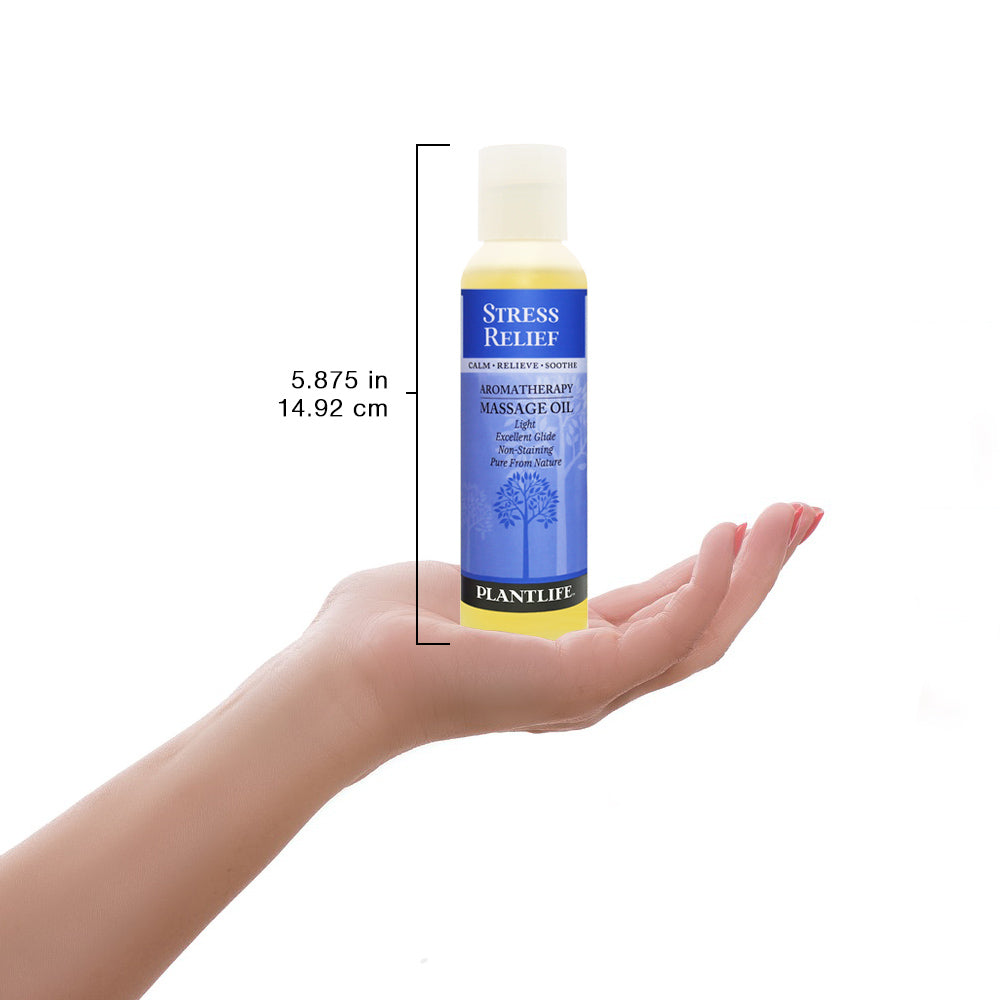 Plantlife Stress Relief massage oil bottle shown with scale for size reference and calming product details.