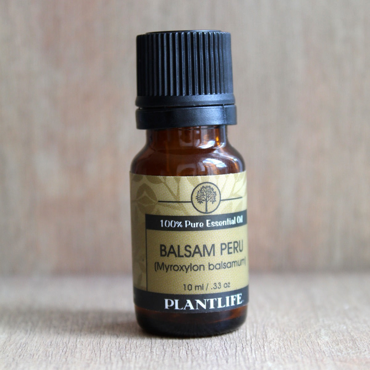 Plantlife Balsam Peru Essential Oil bottle with warm amber tones
