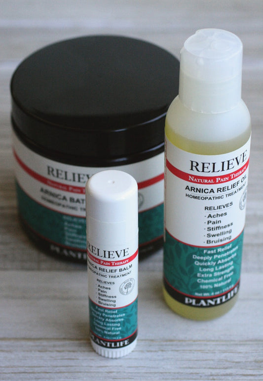 Plantlife Relieve Natural Pain Therapy set featuring Arnica Bath Salt, Arnica Relief Balm stick, and Arnica Relief Oil for pain, swelling, stiffness, and bruising