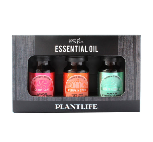 Plantlife Limited Edition Essential Oil Set featuring Candy Cane, Pumpkin Spice, and Winter Forest blends in a festive black gift box