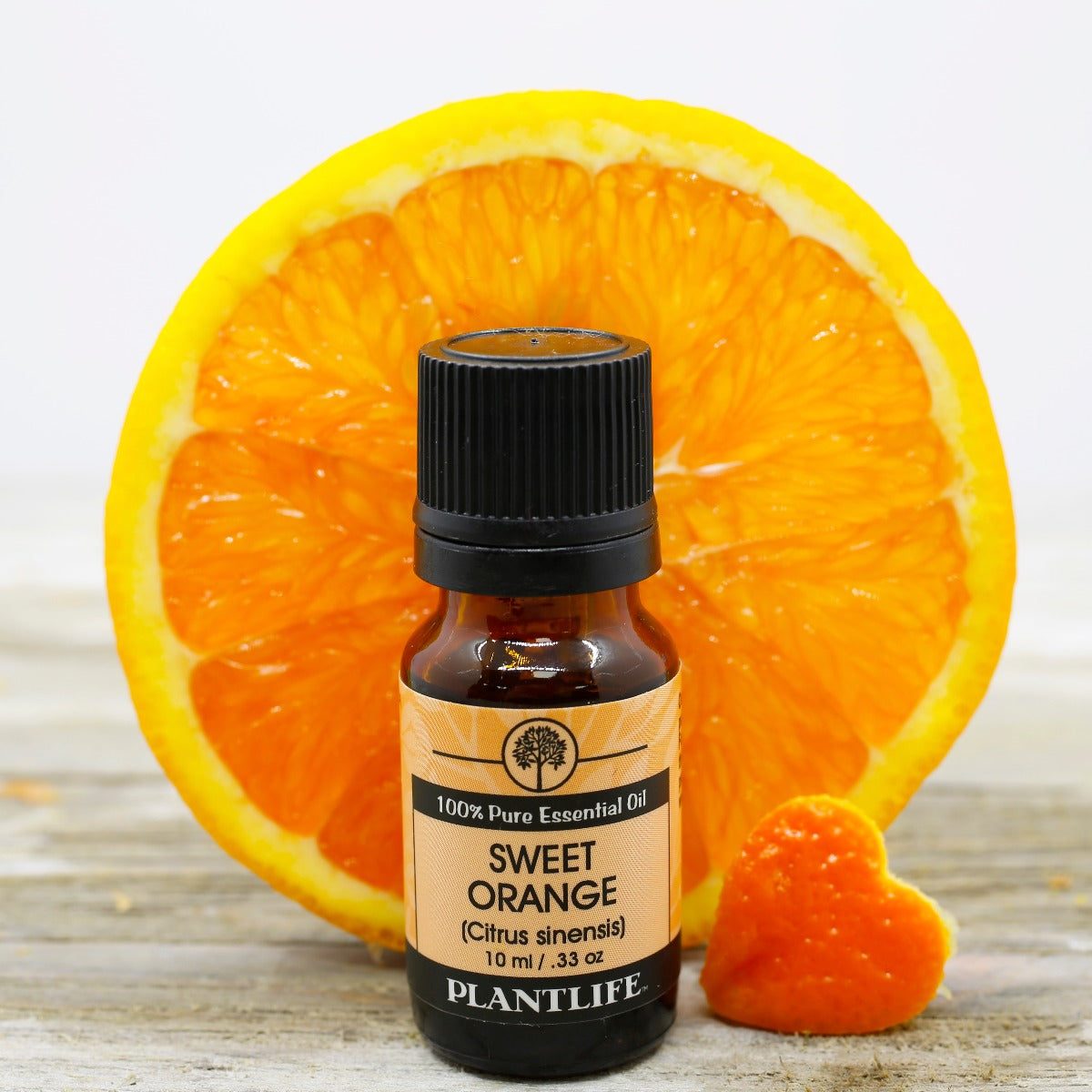 Plantlife Sweet Orange Essential Oil bottle with cheerful citrus notes
