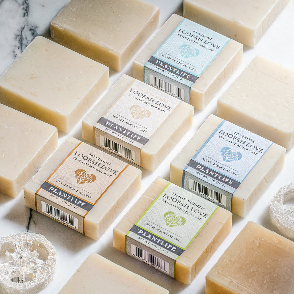 Various bars of soap with visible Plantae branding on a light background