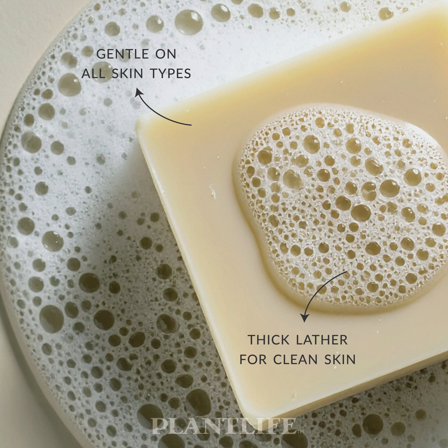 Close-up of a creamy beige Plantlife Eucalyptus Soap bar resting in foamy water. Text highlights “Gentle on all skin types” and “Thick lather for clean skin.” Refreshing eucalyptus soap handcrafted with pure essential oils for a soothing, invigorating cleanse.
