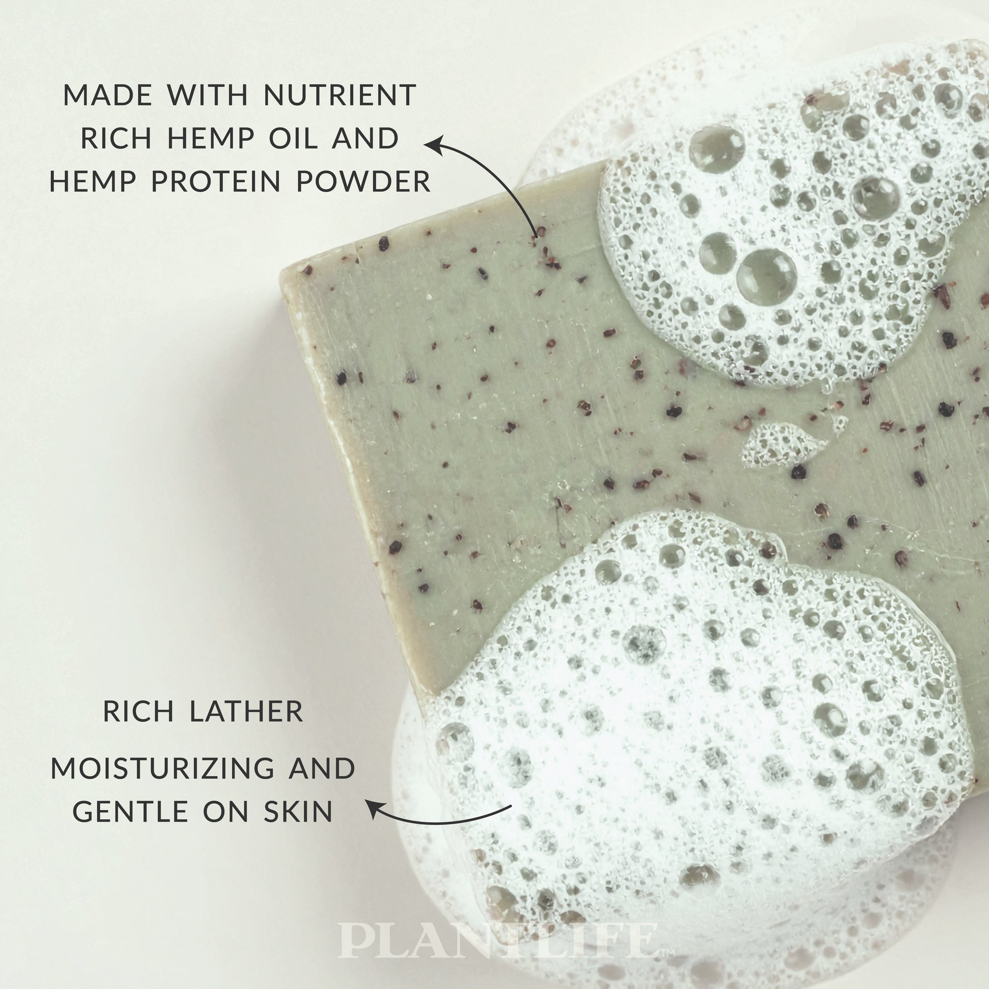 Plantlife Hemp Soap bar with visible hemp seeds and rich lather bubbles. Text reads “Made with nutrient-rich hemp oil and hemp protein powder” and “Rich lather moisturizing and gentle on skin.” Natural plant-based soap crafted to cleanse and condition with nourishing essential oils.