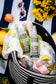 Plantlife Herbal Insect Itch Relief Spray and Herbal Insect Body Spray 4 fl oz bottles in a picnic bag for DEET-free outdoor skin care and after-bite relief