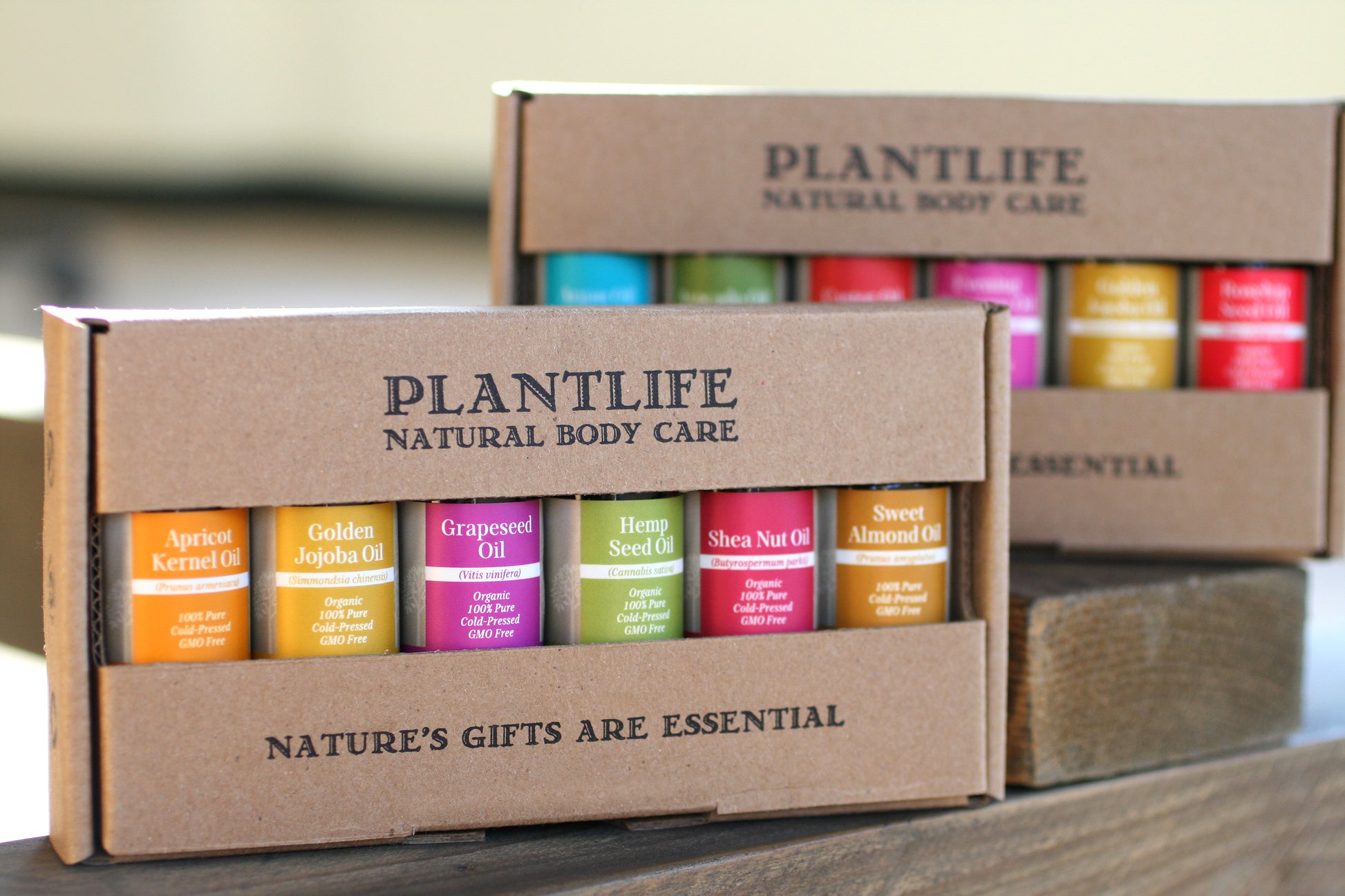 Plantlife natural body care product packaging with various colored bottles.