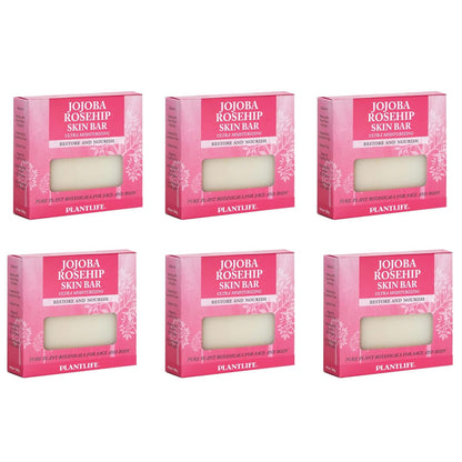 Six boxes of Jojoba Rosehip Skin Bar with pink packaging on a white background