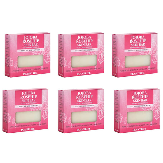 Six boxes of Jojoba Rosehip Skin Bar with pink packaging on a white background