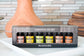 Set of essential oils in a box with 'Plantlife' branding on a table.