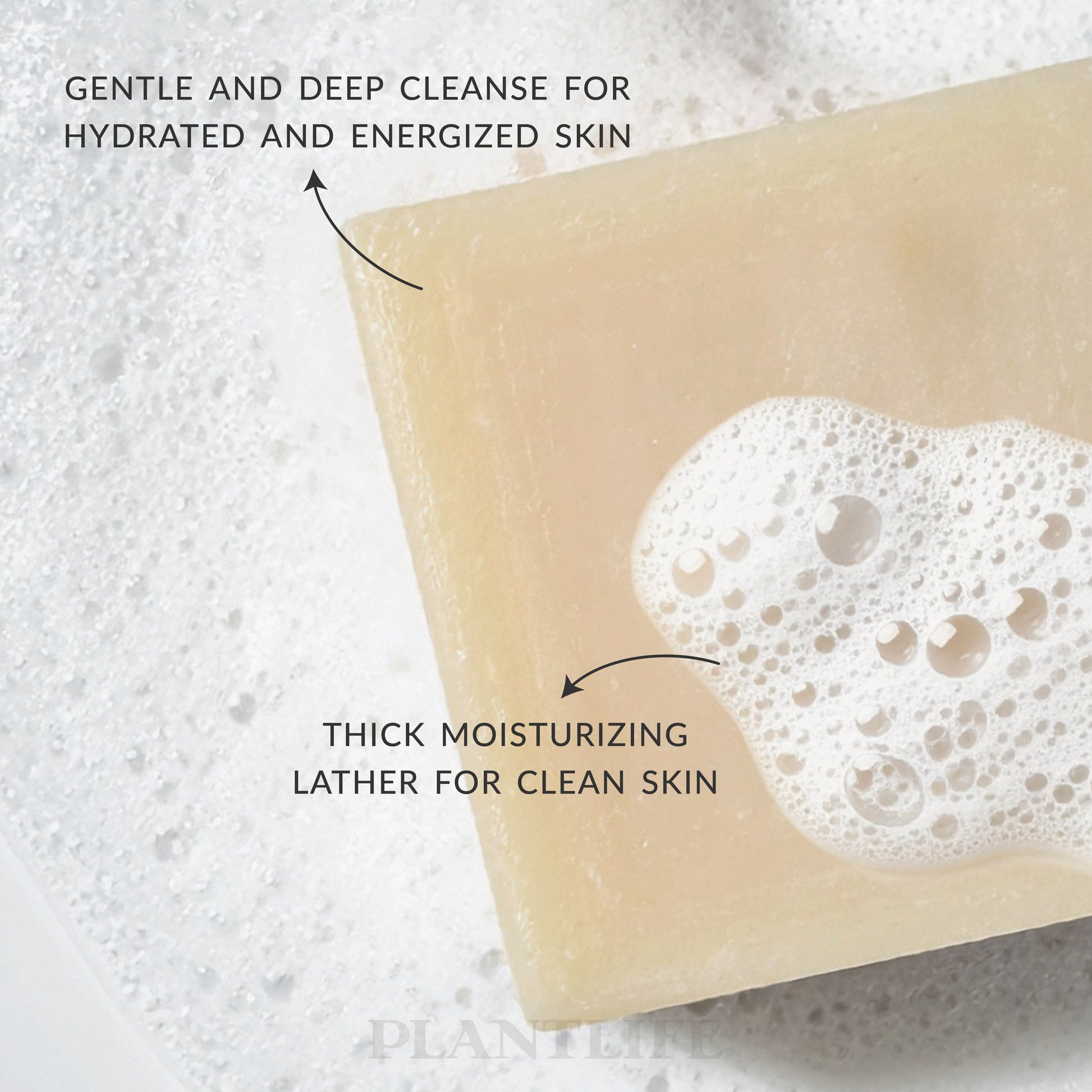 Bar of soap with foam on a textured background, labeled for gentle and deep cleanse.