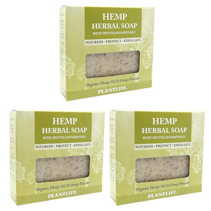 Three bars of hemp herbal soap in green packaging on a white background