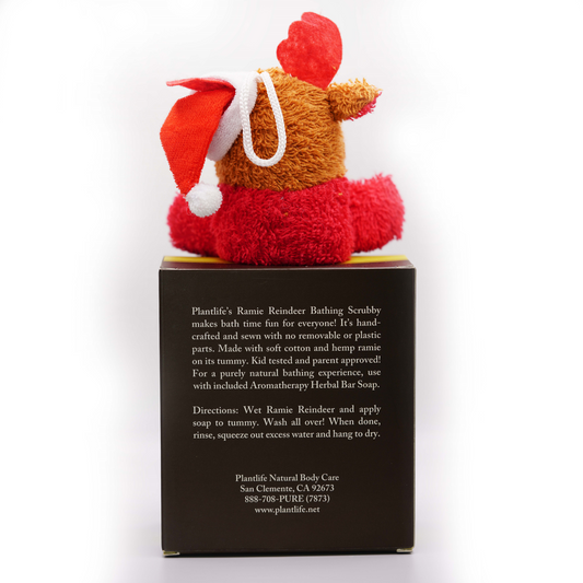 Back of Plantlife holiday gift set featuring instructions and details for the Ramie Reindeer Bathing Scrubby, made of cotton and hemp ramie, designed for use with included Aromatherapy Herbal Bar Soap.