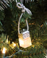 Silver Passive Diffuser by Plantlife hanging on a Christmas tree – festive essential oil air freshener ornament.
