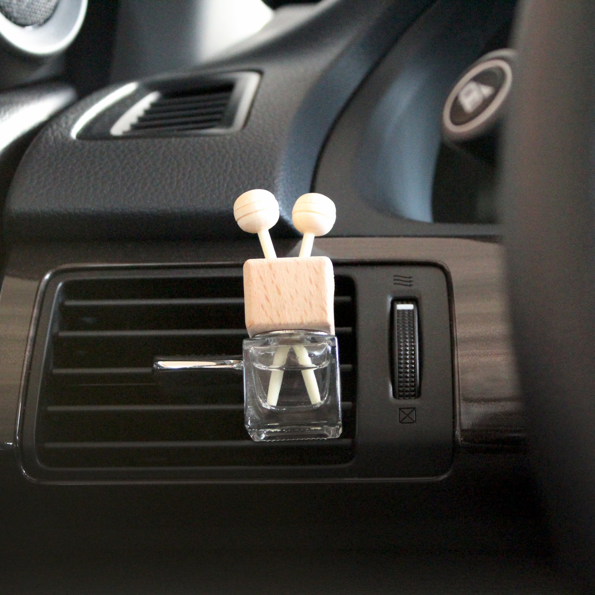 Plantlife Wooden Car Vent Diffuser – eco-friendly clip-on essential oil diffuser disperses natural aroma through vehicle air vent system.